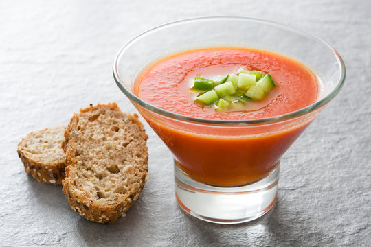 Traditional Spanish cold gazpacho soup on gray stone.
