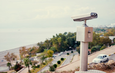 Coin Operated Binocular viewer next to the waterside promenade in Antalya looking out to the bay and city.