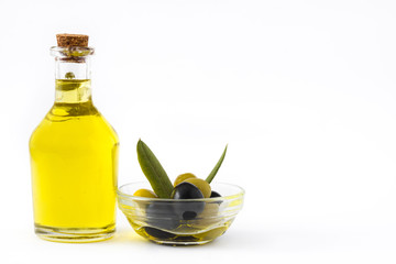 Virgin olive oil in a crystal bottle isolated on white background
