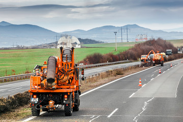 Mechanized truck road cleaning service on the highway