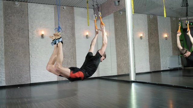 A man performs exercises alfagraviti in the studio 4k