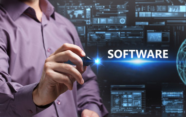 Business, Technology, Internet and network concept. Young businessman working on a virtual screen of the future and sees the inscription: Software