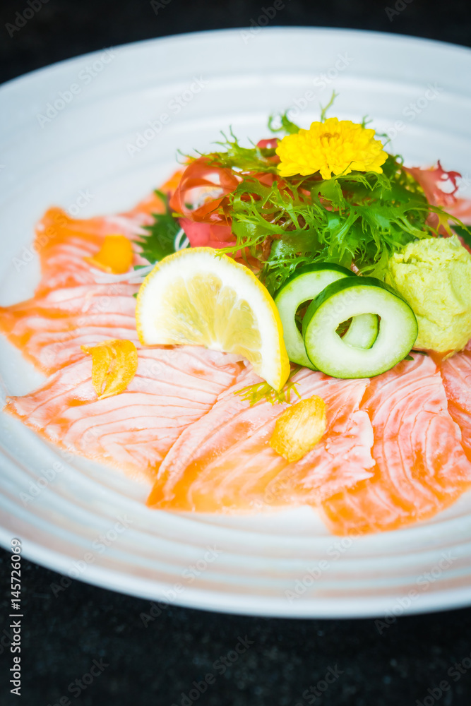 Sticker carpaccio salmon in white plate