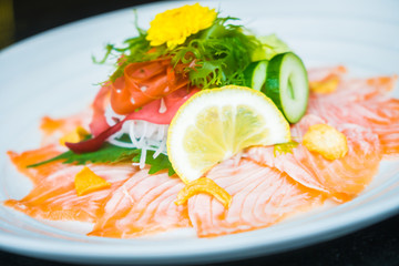 Carpaccio salmon in white plate