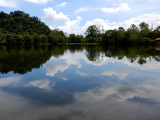 Fototapeta na wymiar Blue sky reflecting in lake