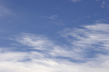 Wispy clouds in blue sky