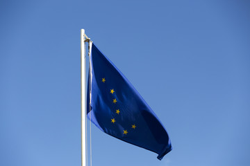 National flag of Alaska on a flagpole