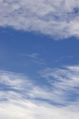 Wispy clouds in blue sky