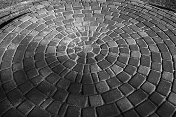 Background gray circular paving slabs. Paving slabs, laid out in circles in the city park of rest