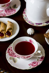 Karkade with sweets on a round table