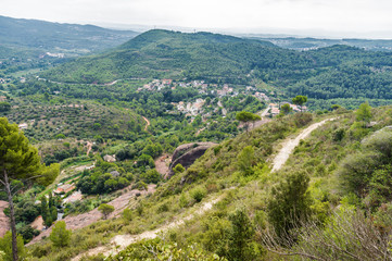 Fototapeta na wymiar Cloudy view of national park Sant Miquel del Fai not fat from Barcelona, Catalonia, Spain.