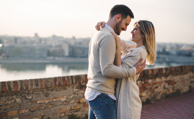 Romantic couple dating in sunset