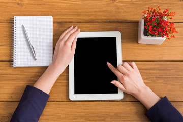 Woman using tablet in coffee shop, close-up