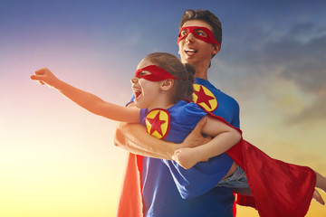 Dad and his daughter playing outdoors