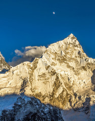 View of the Nuptse (7864 m) and full Moon from the slope of the Kala Patthar - Nepal, Himalayas