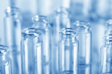 Different laboratory beakers and glassware. Glass jars of different sizes. Chemical glassware.