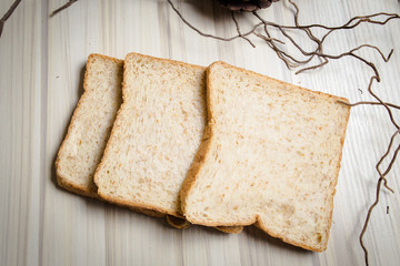 Whole wheat bread image on wood table in kitchen