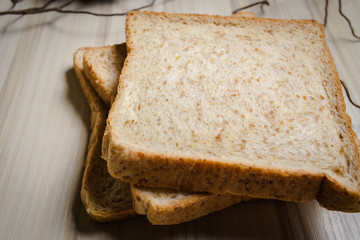 Whole wheat bread image on wood table in kitchen