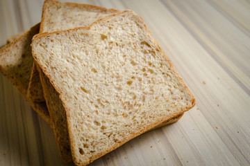 Whole wheat bread image on wood table in kitchen