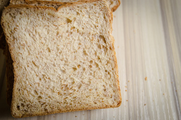 Whole wheat bread image on wood table in kitchen