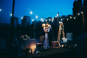 Amazing wedding couple near the river at night