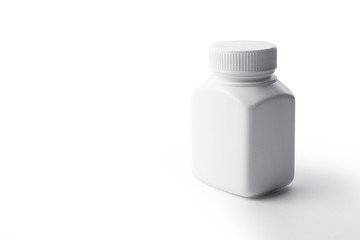White plastic medicine bottle on white background