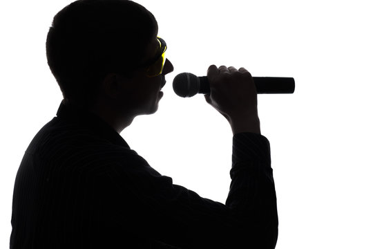 Concert of a artist singing into the microphone