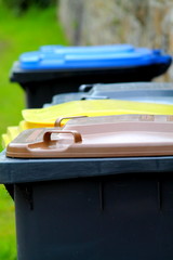 Different rubbish dustbins, colorful hoods. Waste separation. Recycling in Germany.