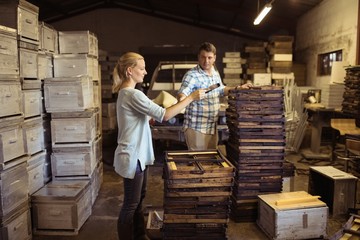 beekeepers working on hive frames in warehouse
