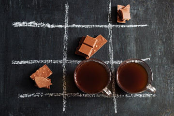 TIC TAC toe with coffee and chocolate.top view.
