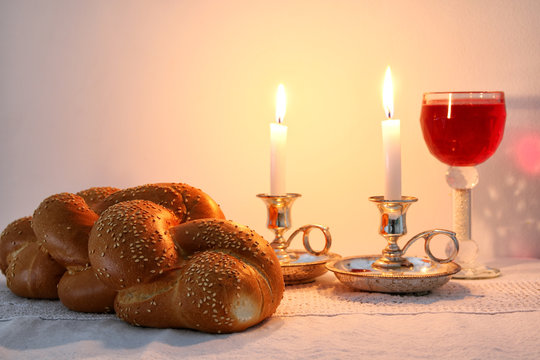 shabbat image. challah bread, shabbat wine and candles