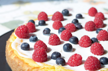 cheese cake decorated with berries close up