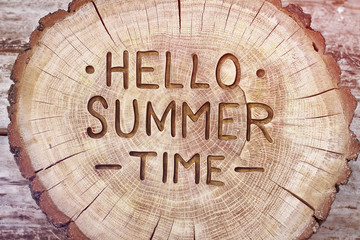 Hello summertime decorative wood carving, background. positive quote for design. Hand lettering inspirational typography poster, photo banner