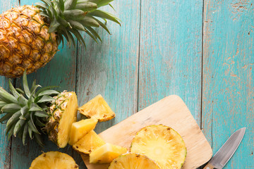 pineapple on the wood texture background..