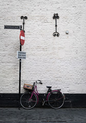Bicycle propped against an old wall in the town of Maastricht, Netherlands
