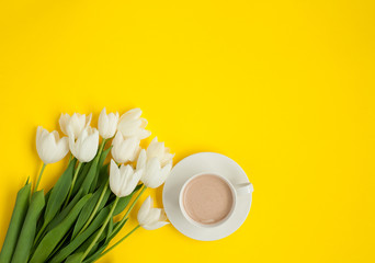 White flowers bunch and coffee cup