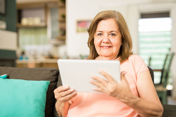Elderly woman using a tablet computer