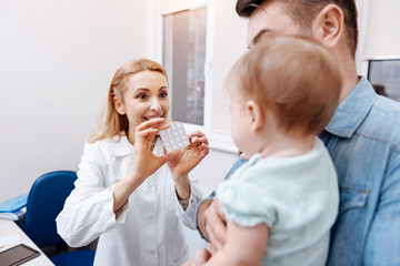 Back side of little patient while looking at nurse