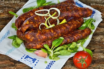 Smoked home sausages with seasoned salad.