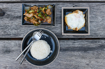 Flat lay of ried rice with holy basil and egg