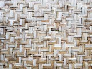 pattern of old Thai house wall for background and texture. Made of bamboo plant stalks