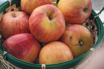 Wicker basket with fresh apples.
