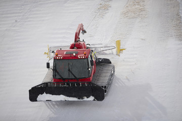 Snowcat working in a storm.