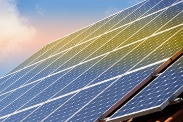 Solar panel with reflection of sunset