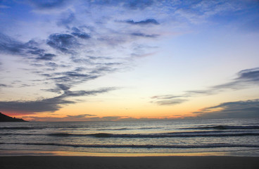 Sunrise on the beach with wave,Thailand