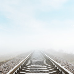 railroad closeup goes to horizon in fog