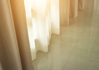 Fototapeta na wymiar Beautiful window blinds, luxury interior of a room with a stone floor tile pattern.