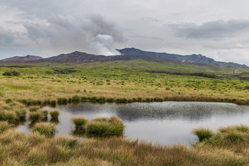 Powerful erupting Mount Aso with little pond in Kumamoto, Japan