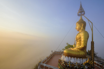 Sunrise and Buddha statue