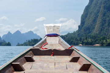 The prow of a boat floating on river